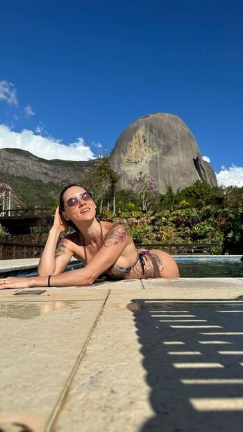 Aline E Charles